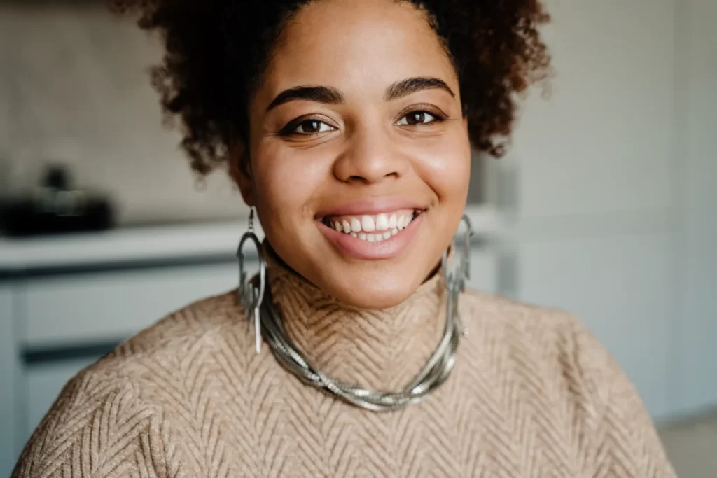 young happy african american woman smiling and loo utc ()